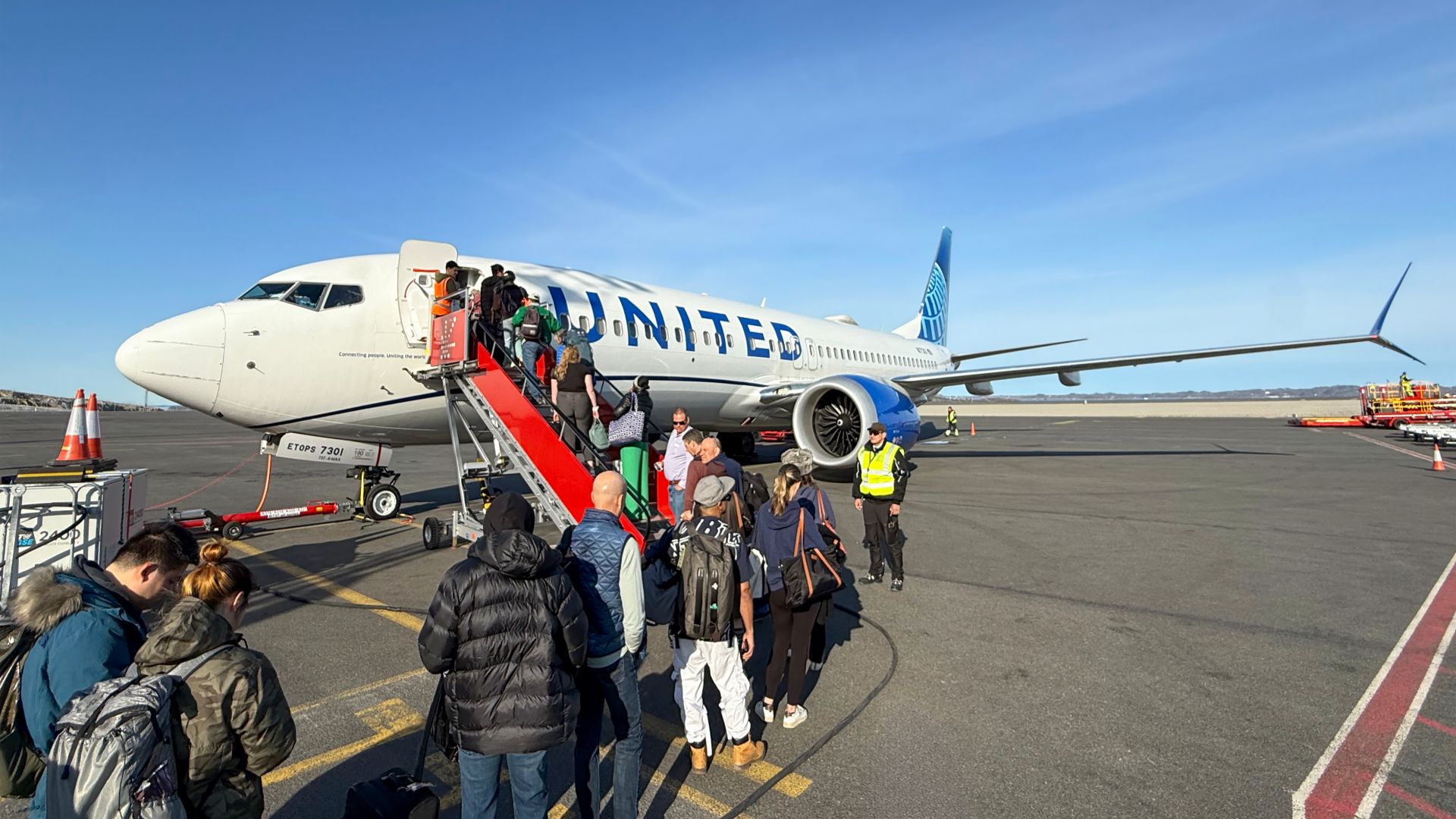 A United Airlines Boeing 737 MAX-8 bound for Newark, USA boarding passengers at Nuuk, Airport in Greenland