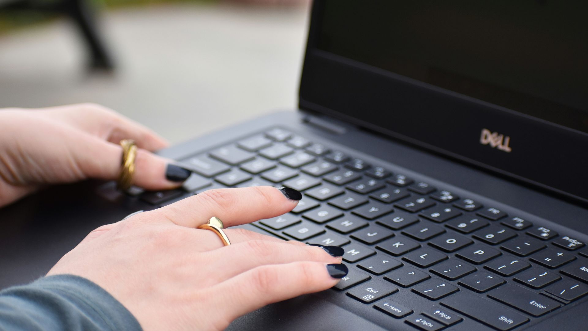 a person typing on a laptop