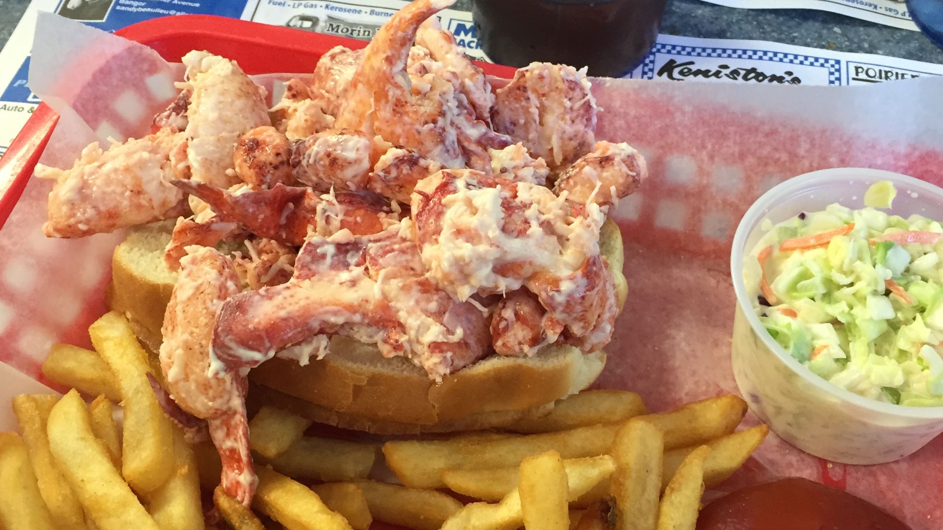 A Maine-style lobster roll as served at the Eagle's Nest in Brewer, Maine. This small restaurant is a local landmark, sitting on the edge of a cliff overlooking the Penobscot River. In fact, bald eagles are frequently sighted from the windows in the restaurant's dining room. This restaurant was formerly known as the Pine Cone Diner. This restaurant is located on Route 9, in Brewer, Maine.