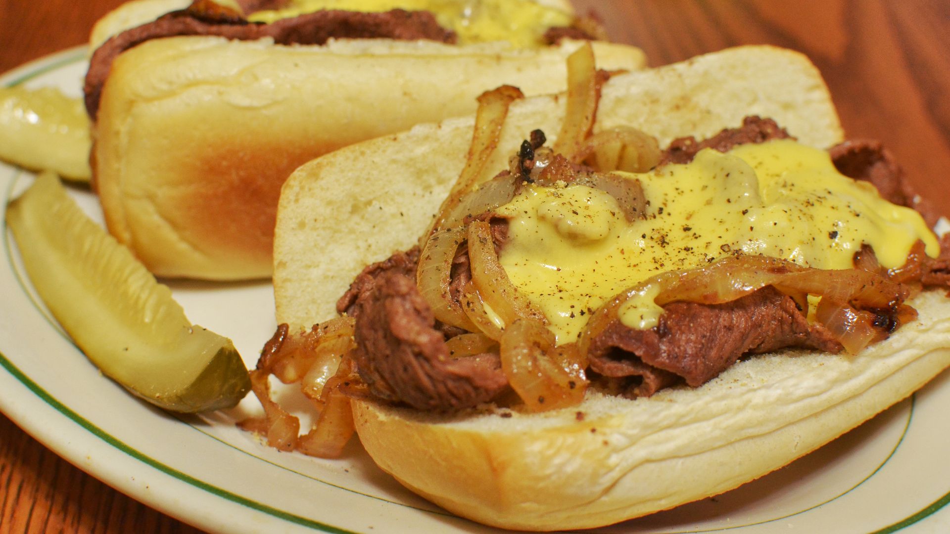 Cheesesteak sandwiches with pickles