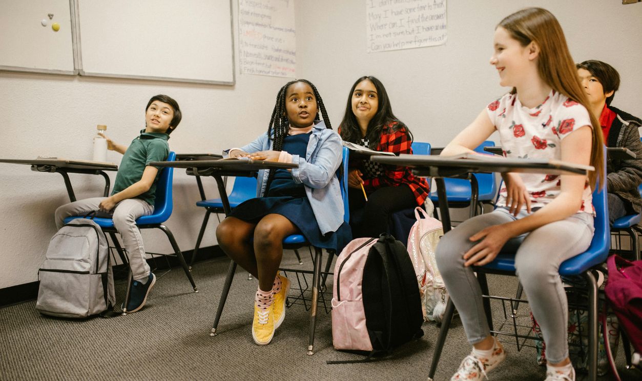 A diverse group of students attentively participating in a classroom 