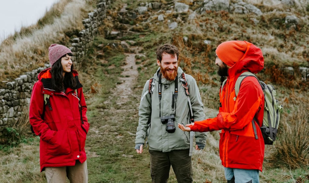 traveler politely talking tour guide smiling calm