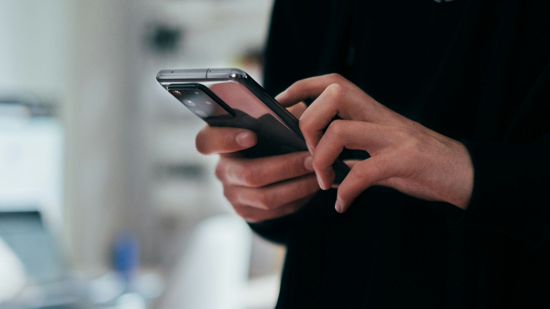 person holding black android smartphone