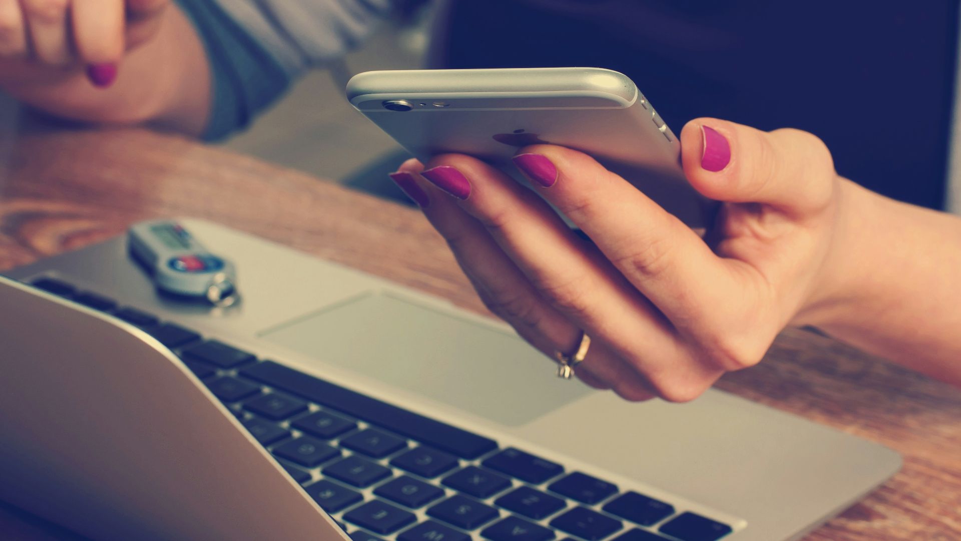 woman holding silver iPhone 6