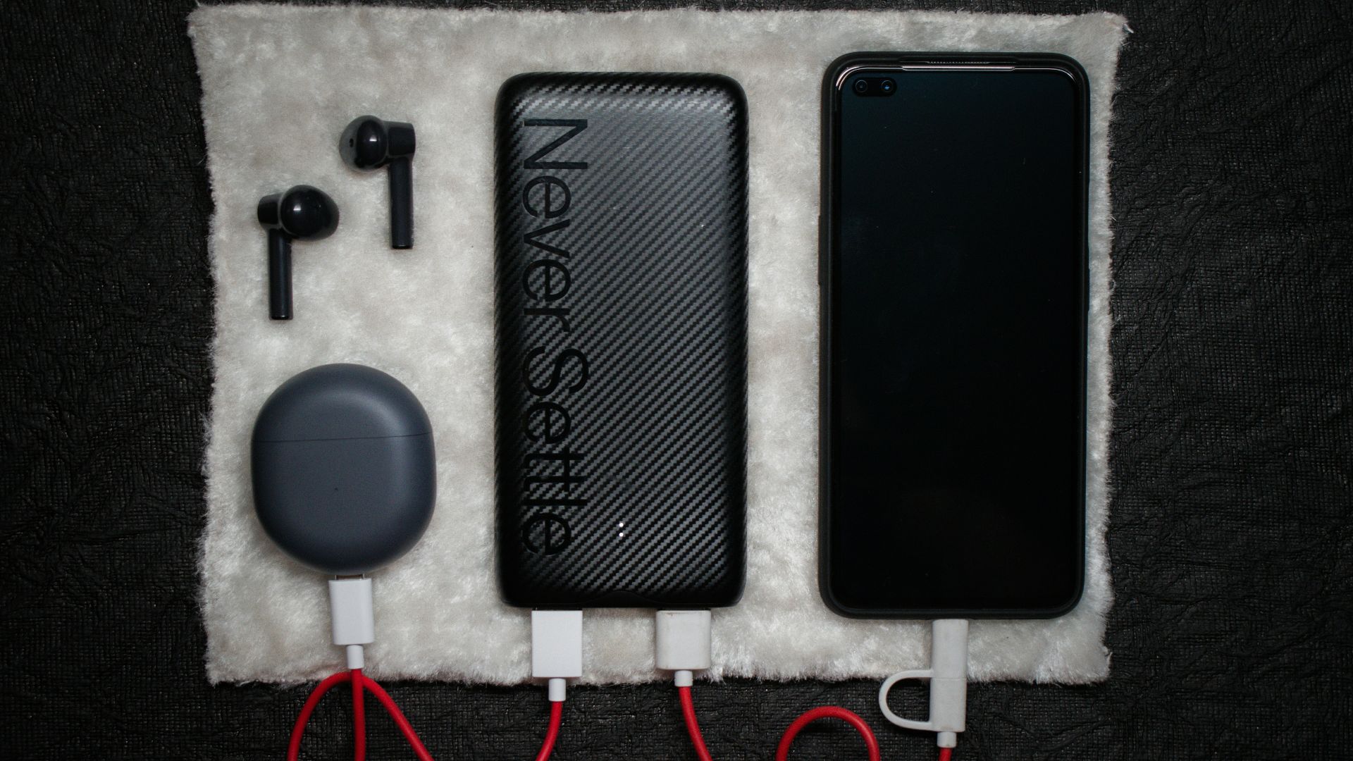 black iphone 5 c beside white usb cable