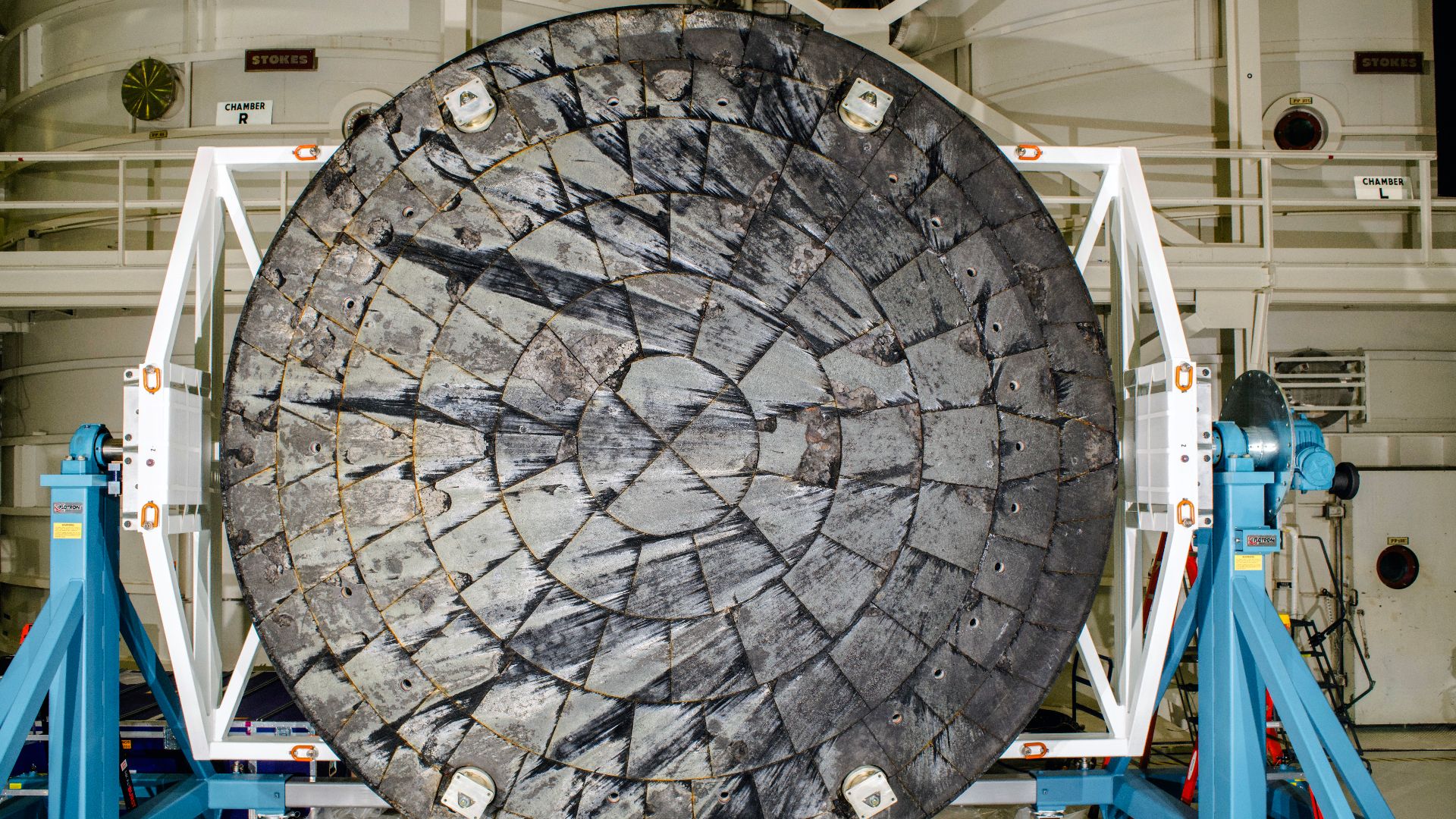 After NASA’s Orion spacecraft was recovered at the conclusion of the Artemis I test flight and transported to NASA’s Kennedy Space Center in Florida, its heat shield was removed from the crew module inside the Operations and Checkout Building and rotated 