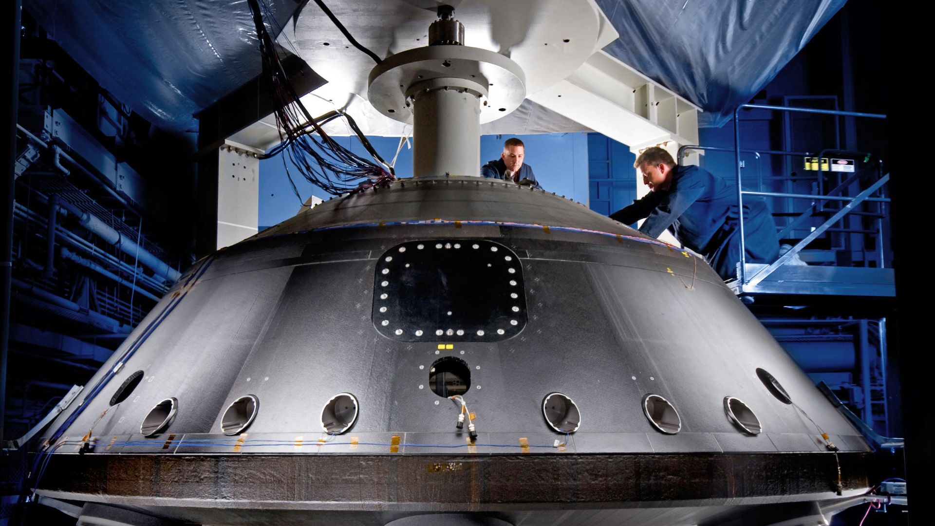 This image from July 2008 shows the aeroshell for NASA's Mars Science Laboratory while it was being worked on by spacecraft technicians at Lockheed Martin Space Systems Company near Denver.
This hardware was delivered in early fall of 2008 to NASA's Jet P