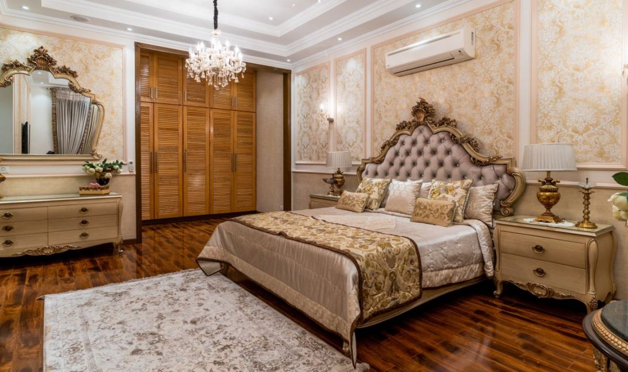 Elegant interior of a luxury bedroom with chandeliers and classic furniture, exuding opulence and style