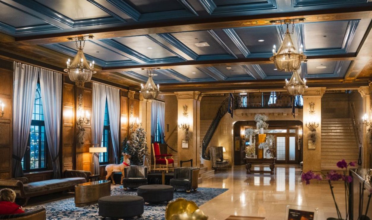 Luxurious hotel lobby in Quebec, Canada featuring elegant decor and grand chandeliers.