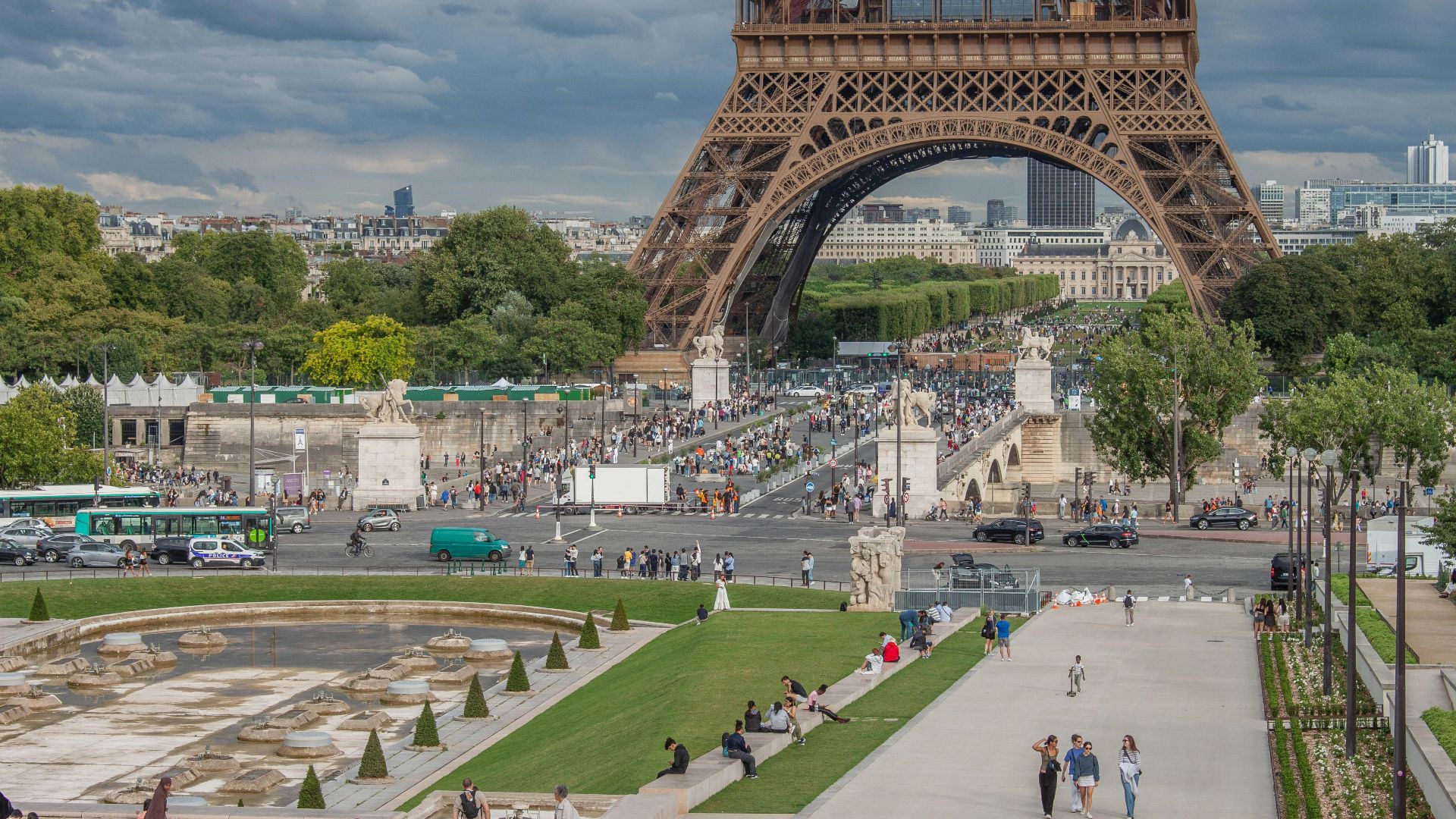 The eiffel tower towers above the crowds in paris.