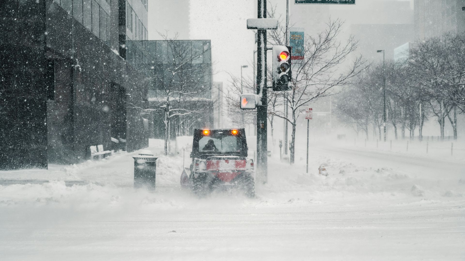 black car on snow covered road during daytime