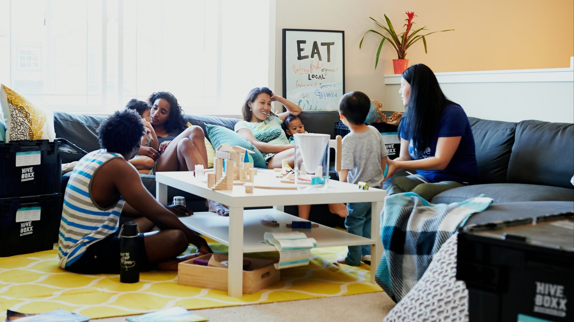 group of people sitting on chair in front of table