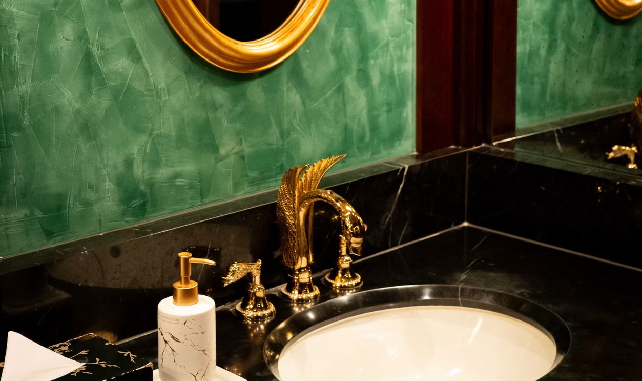 A bathroom with two sinks and two mirrors