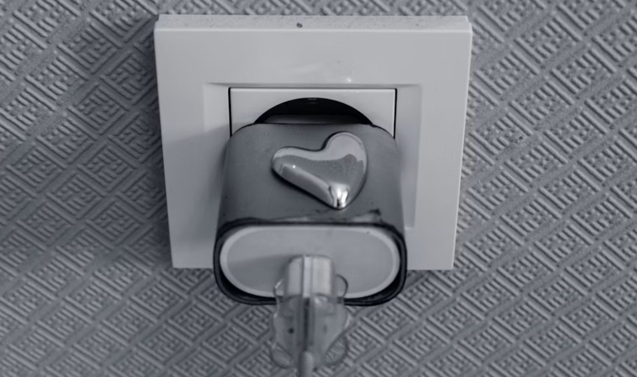 Electrical outlet with a heart-shaped plug