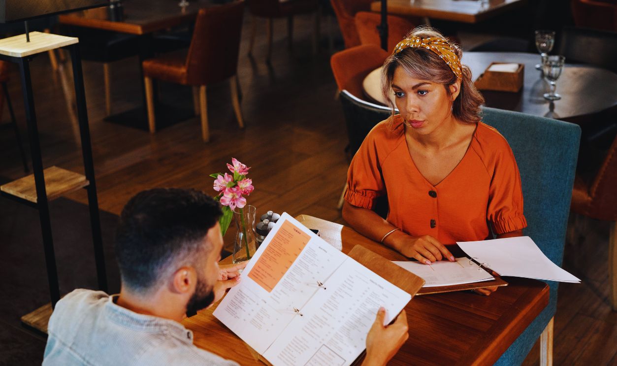 Woman restaurant checking menu