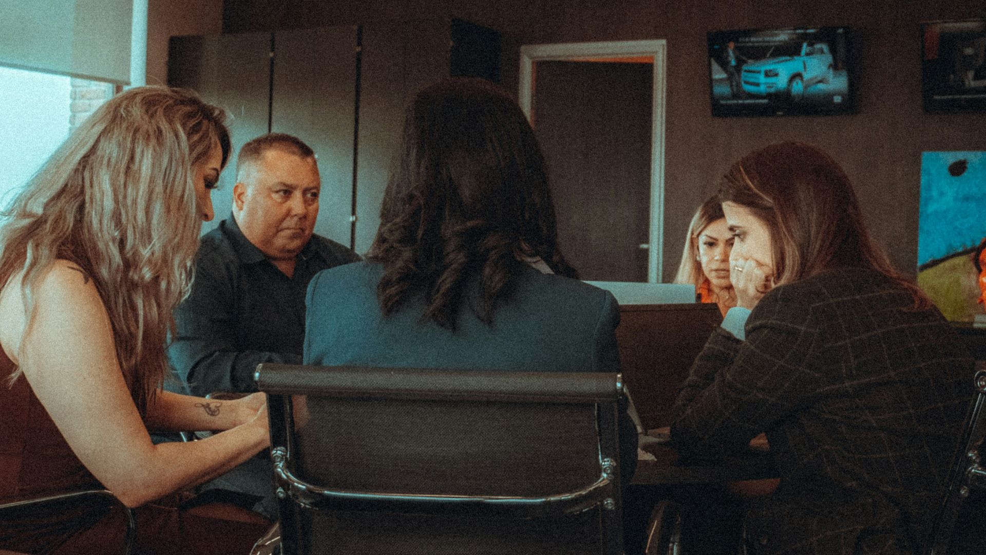 a group of people sitting around a table