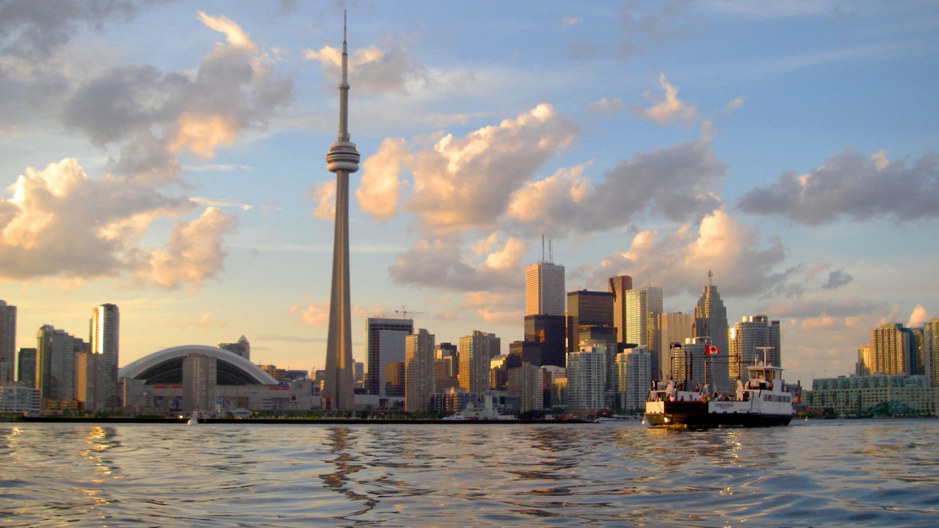 View of Toronto skyline from Toronto Harbour.  Toronto Island ferry in foreground.  Toronto, Canada.