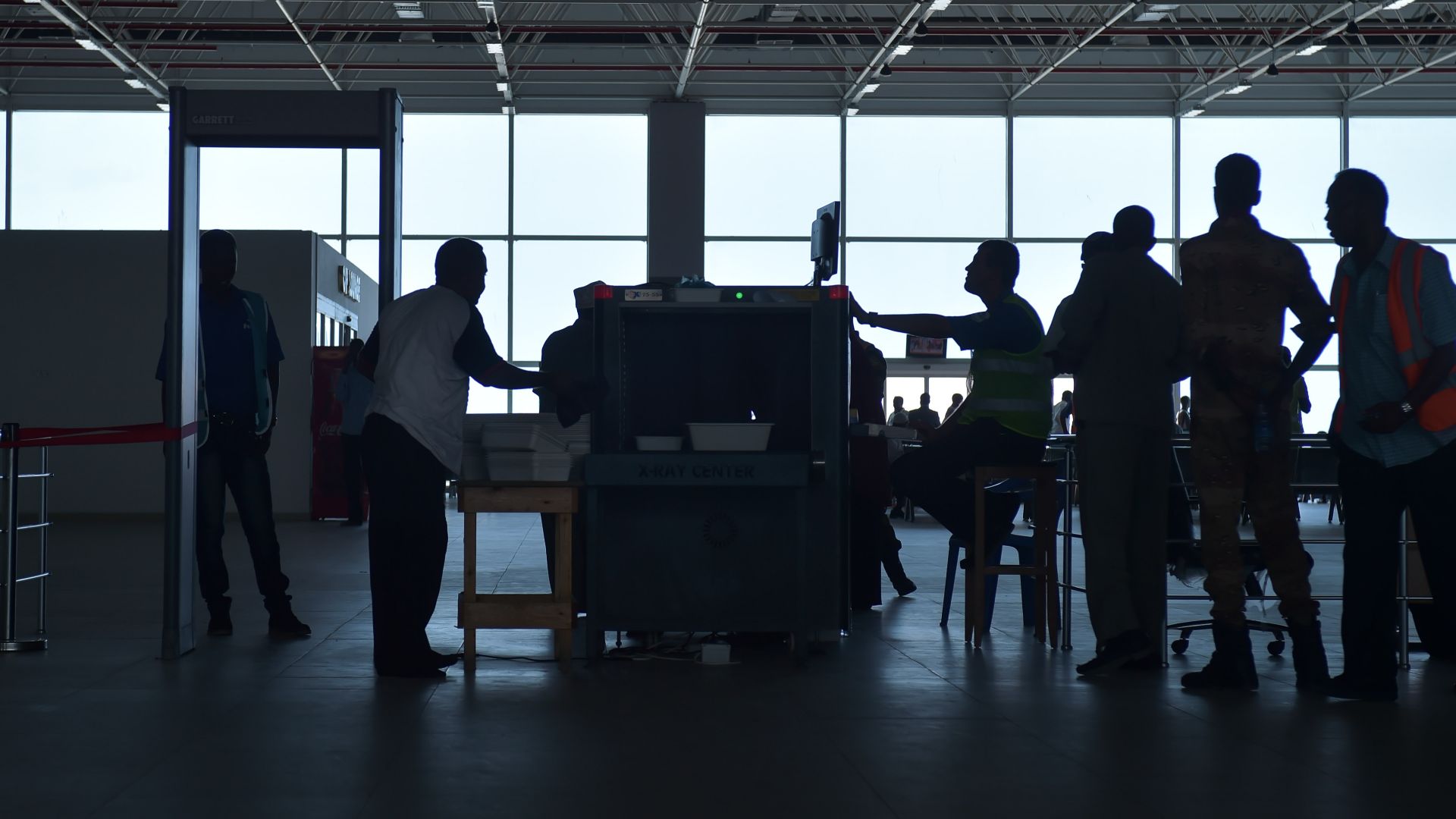 Passengers scan their luggage through an x-ray machine at Aden Adde International Airport in Mogadishu, Somalia, on April 19. After an explosion ripped a hole in the side of a Daalo Airline's airplane in February of 2016, security at Aden Adde Internation