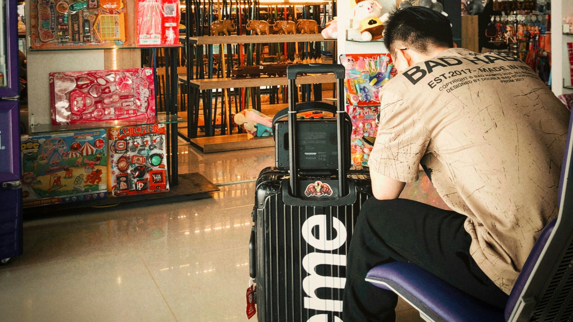 a man sitting on a chair in a store