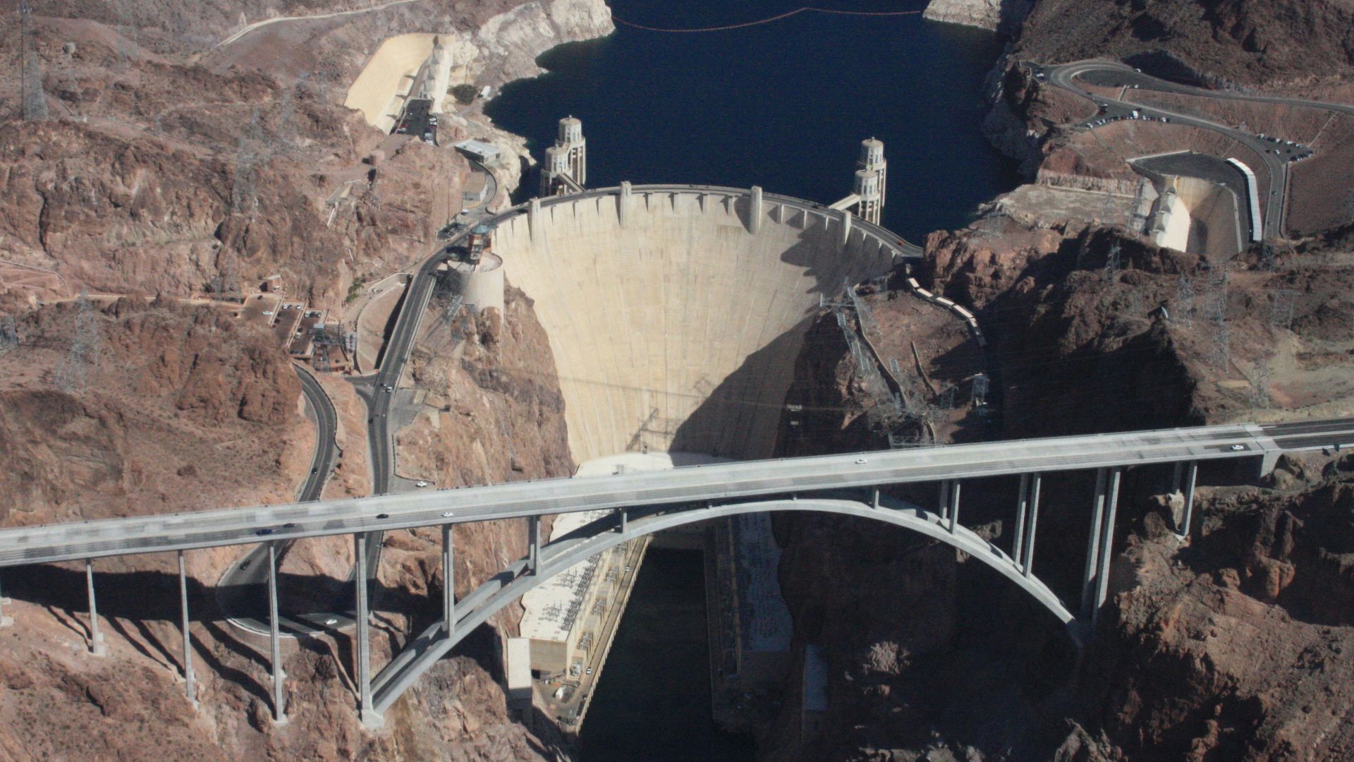 The Hoover Dam from the air.  Colorado river and Lake Mead. Significant water level decline is indicated by the white high water line,