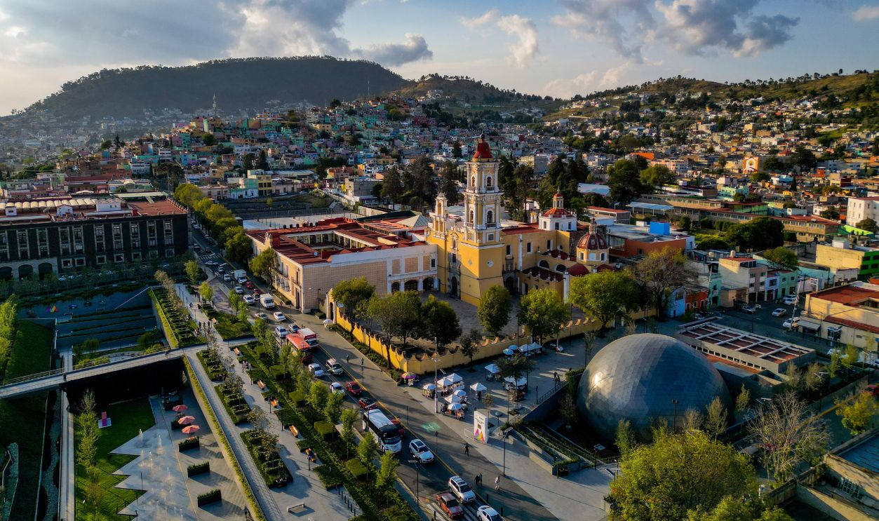 Drone capture of Toluca de Lerdo, showcasing historic architecture and urban landscape.