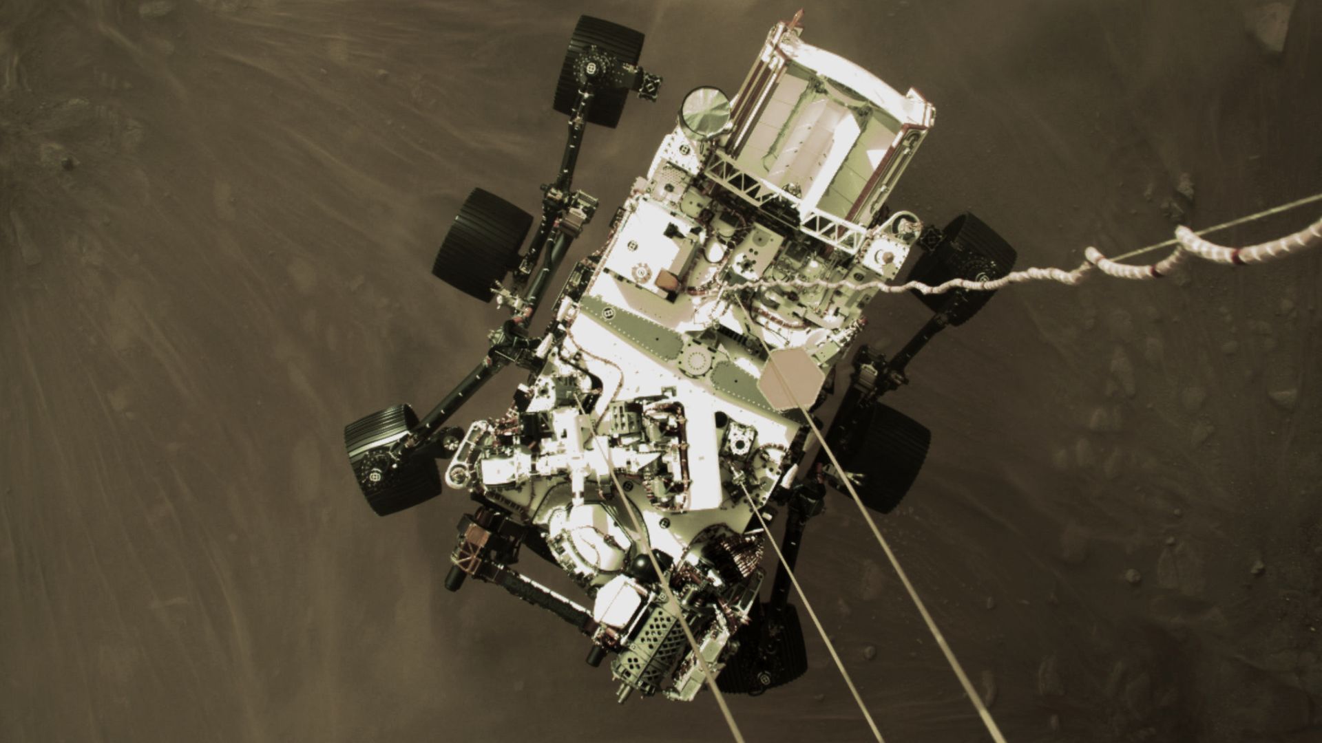 This high-resolution still image is part of a video taken by several cameras as NASA’s Perseverance rover touched down on Mars on February 18, 2021. A camera aboard the descent stage captured this shot.