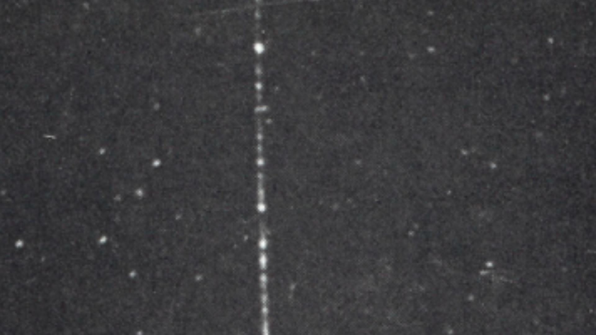 A muon particle passing through  lead  in a cloud chamber