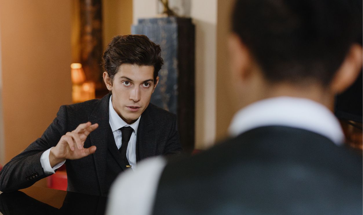 A classy interaction between a gentleman and a waiter