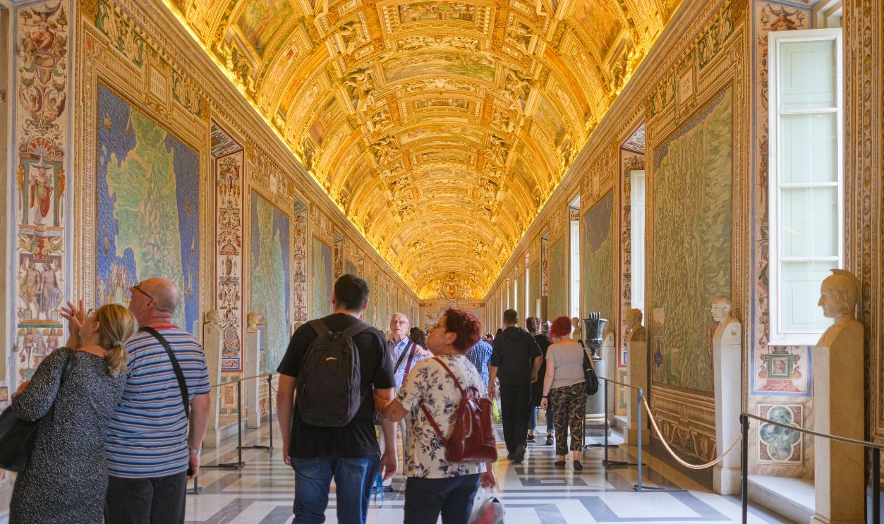 Explore the ornate and golden ceilings of the Vatican Museums filled with art and history.