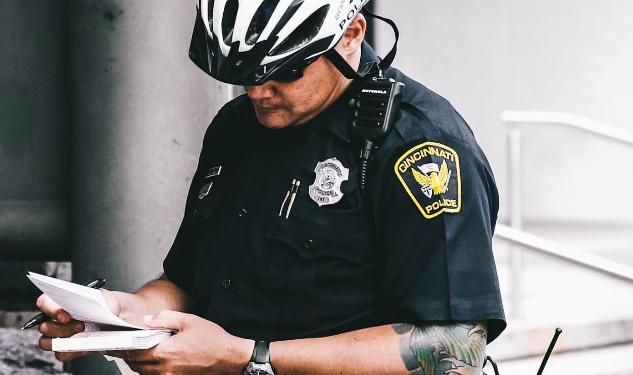officer reading notes