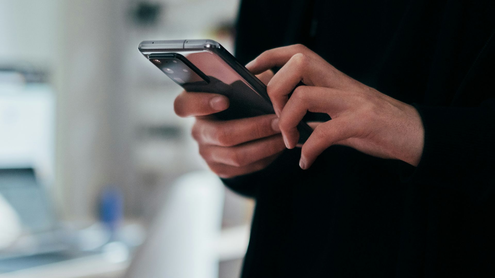 person holding black android smartphone