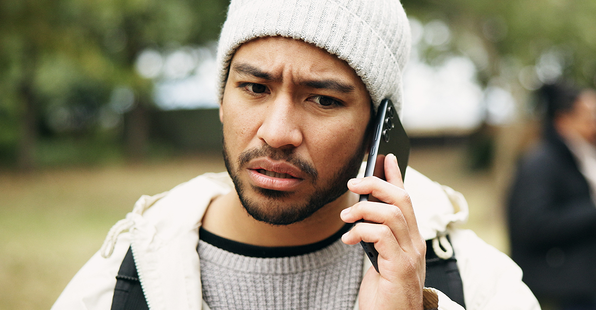 Worried man on the phone.