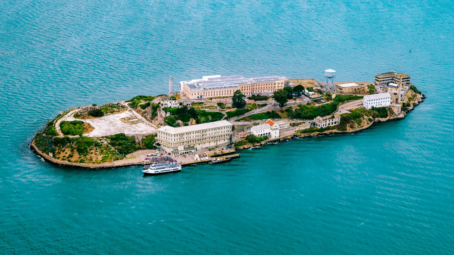 top view photography of island surrounded by body of water
