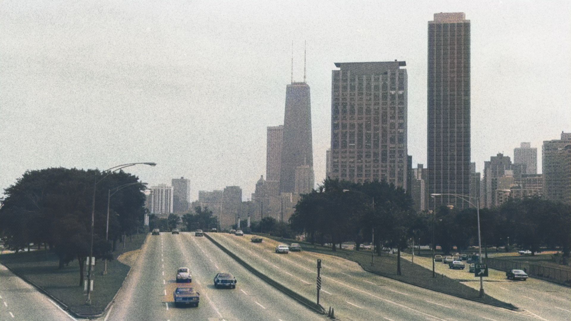 Lake Shore Drive in Chicago Illinois in 1978. Black and white photograph colorized with IMG2GO. On the skyline is, from left, the John Hancock Center (875 North Michigan Avenue, 1968), 1550 N Lake Shore Drive apartments (1961), and 1555 N Astor Street apa