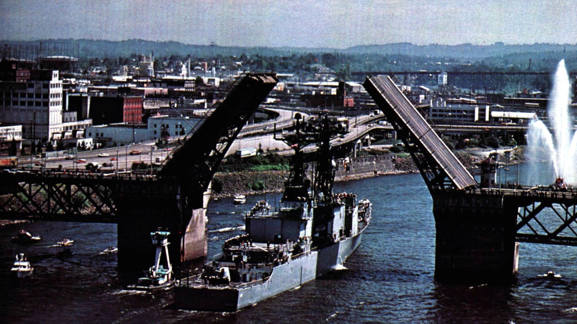 The U.S. Navy destroyer USS Kinkaid (DD-965) passing the Burnside Bridge at Portland, Oregon. Kinkaid visited Portland on occasion of the 1979 Rose Festival.