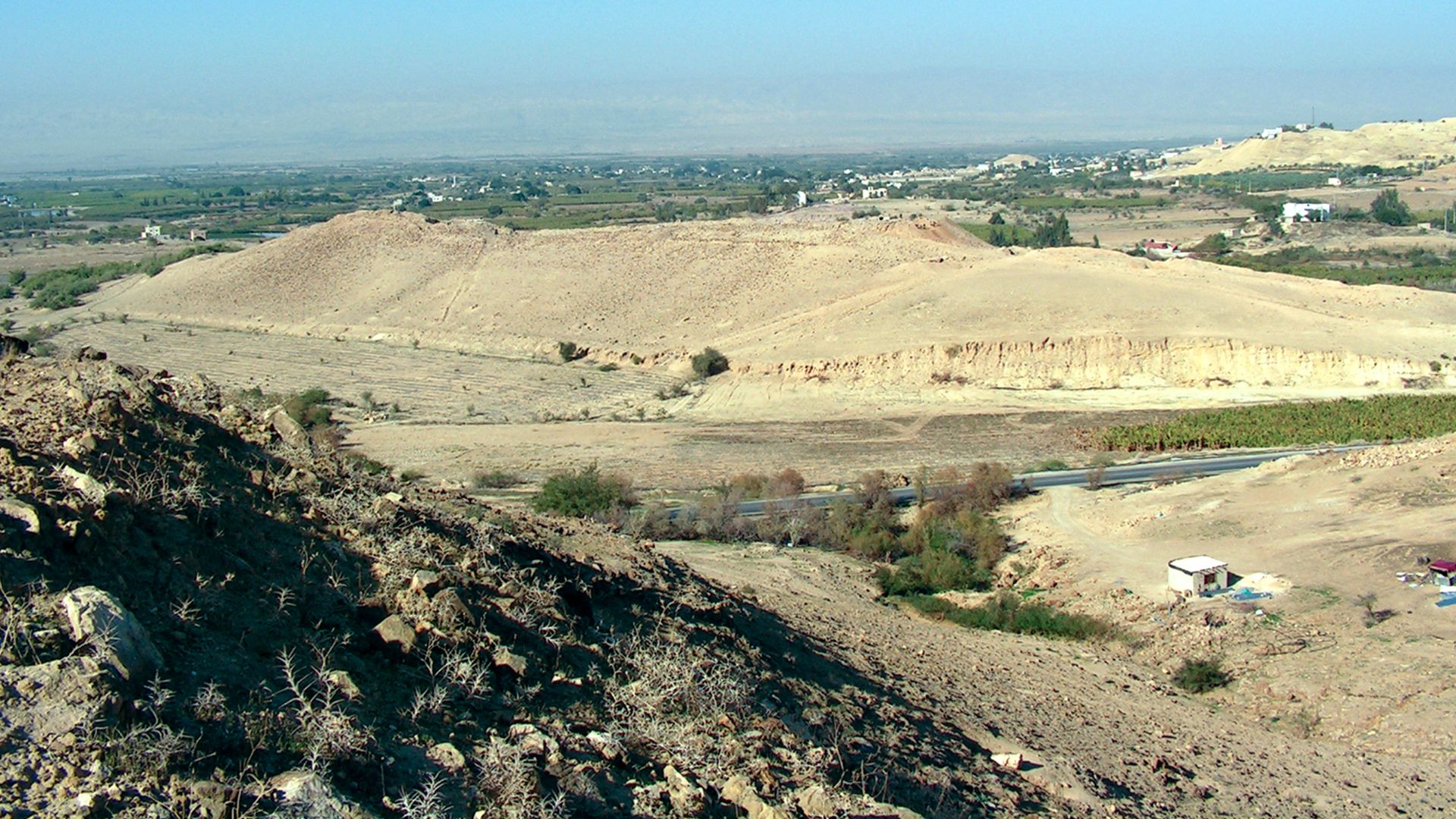 The archaeological site of Tall el-Hammam, Jordan that overlooks the Jordan Valley. Jericho is visible on the horizon and Tall Kefrein is visible in the distance on the right side out on the valley.