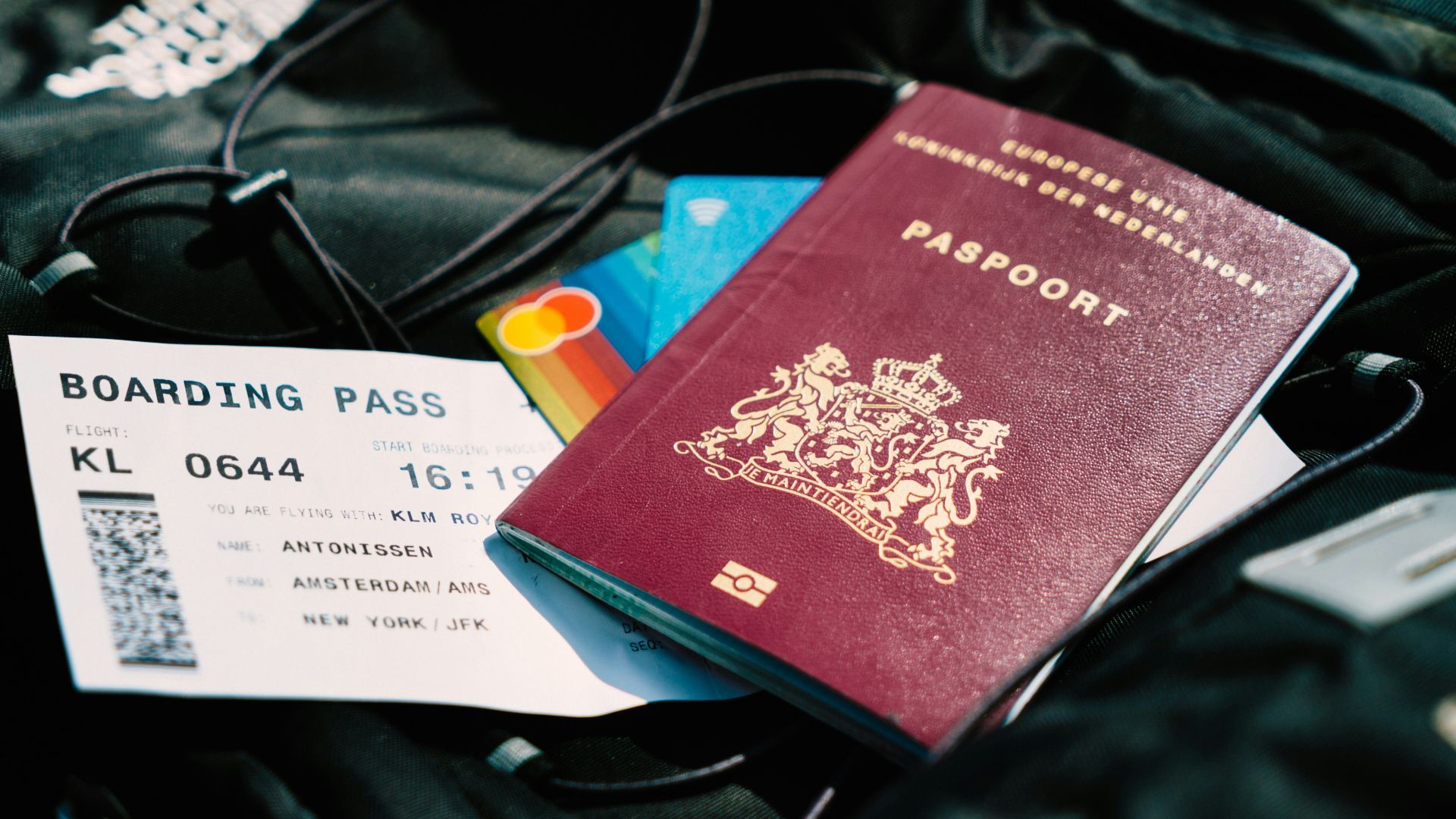 a passport and a boarding pass are on a bag