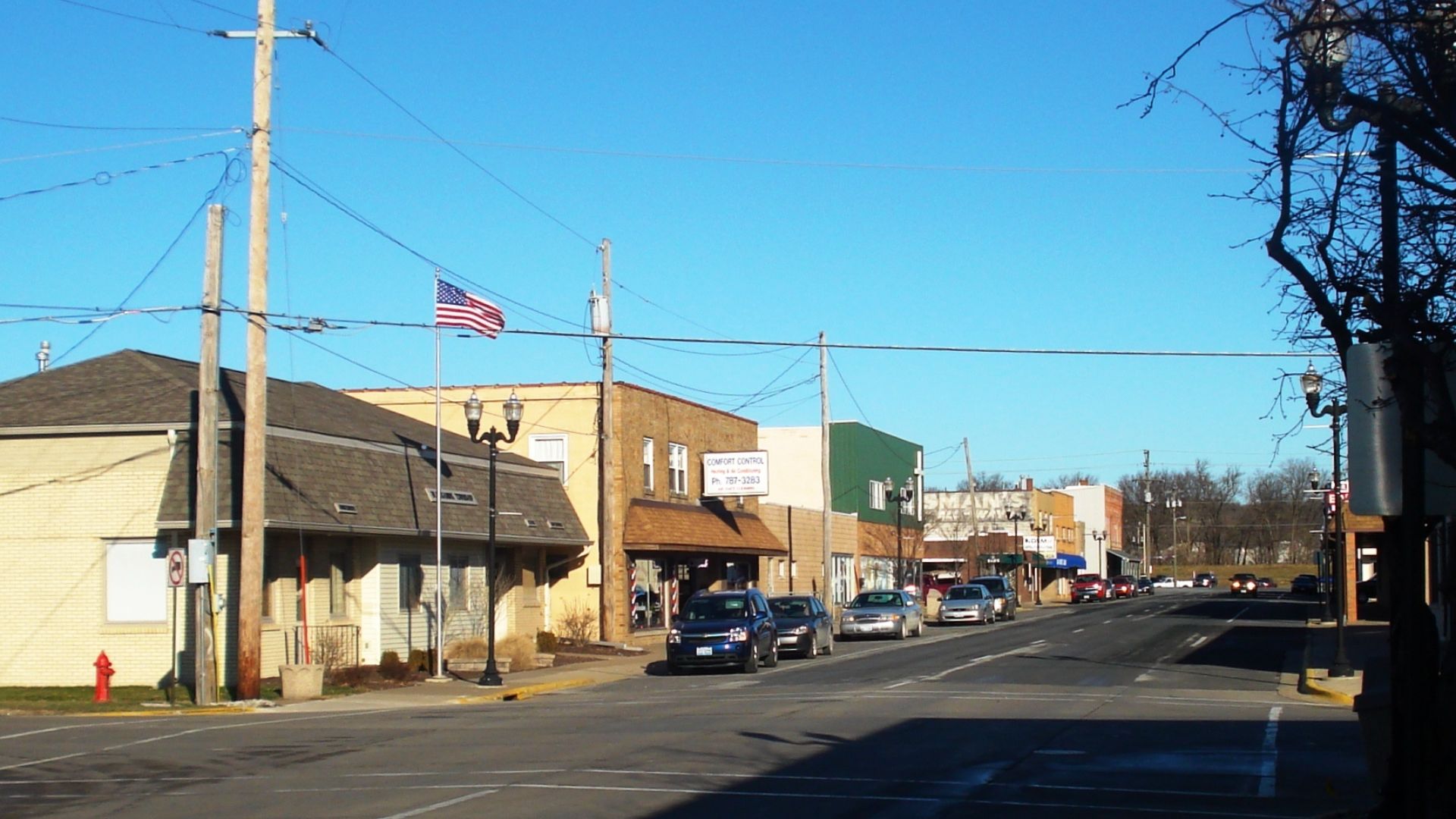 west side of 4th Street West, looking north from West 3rd Avenue, Milan, Illinois; at left, Blackhawk Township Hall, 230-234 4th Street West