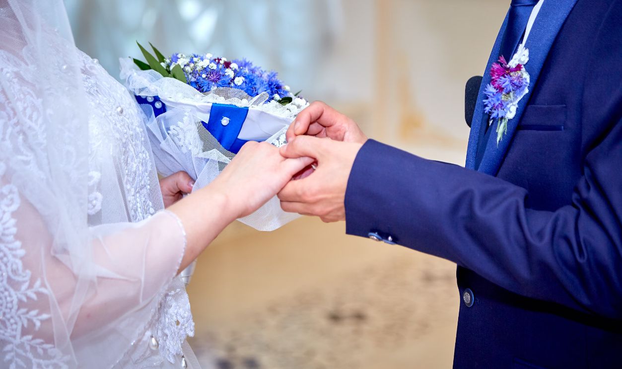 Elegant wedding ceremony with bride and groom exchanging rings