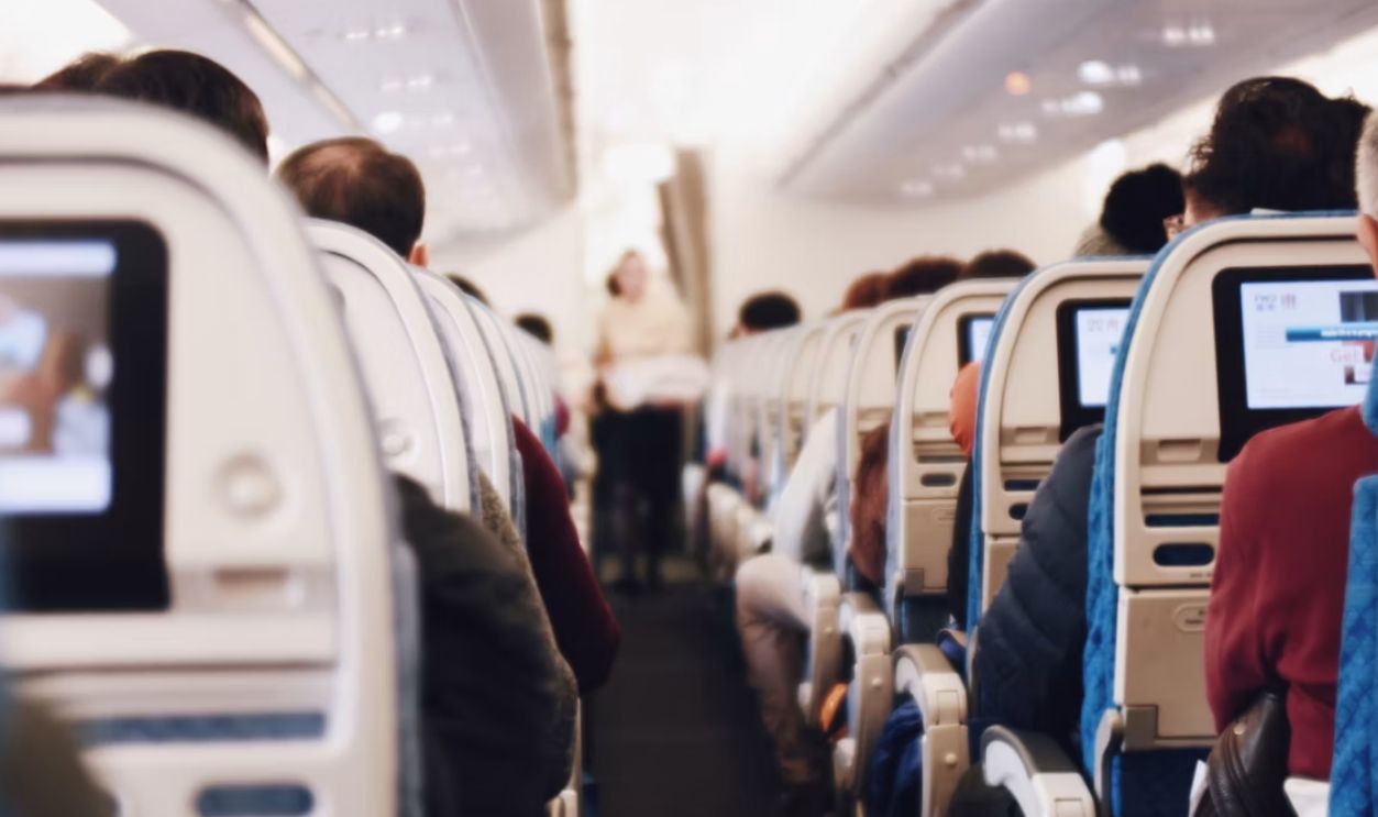 shallow focus photography of people inside of passenger plane