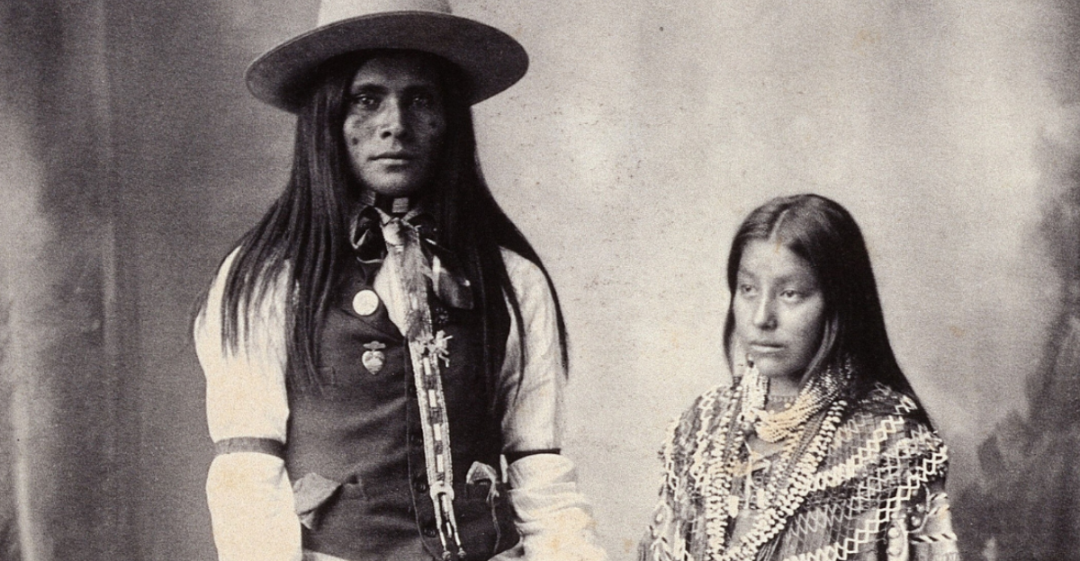 A native American man and woman Platinum print by FA Rinehart, 1898. People in vintage photograph.