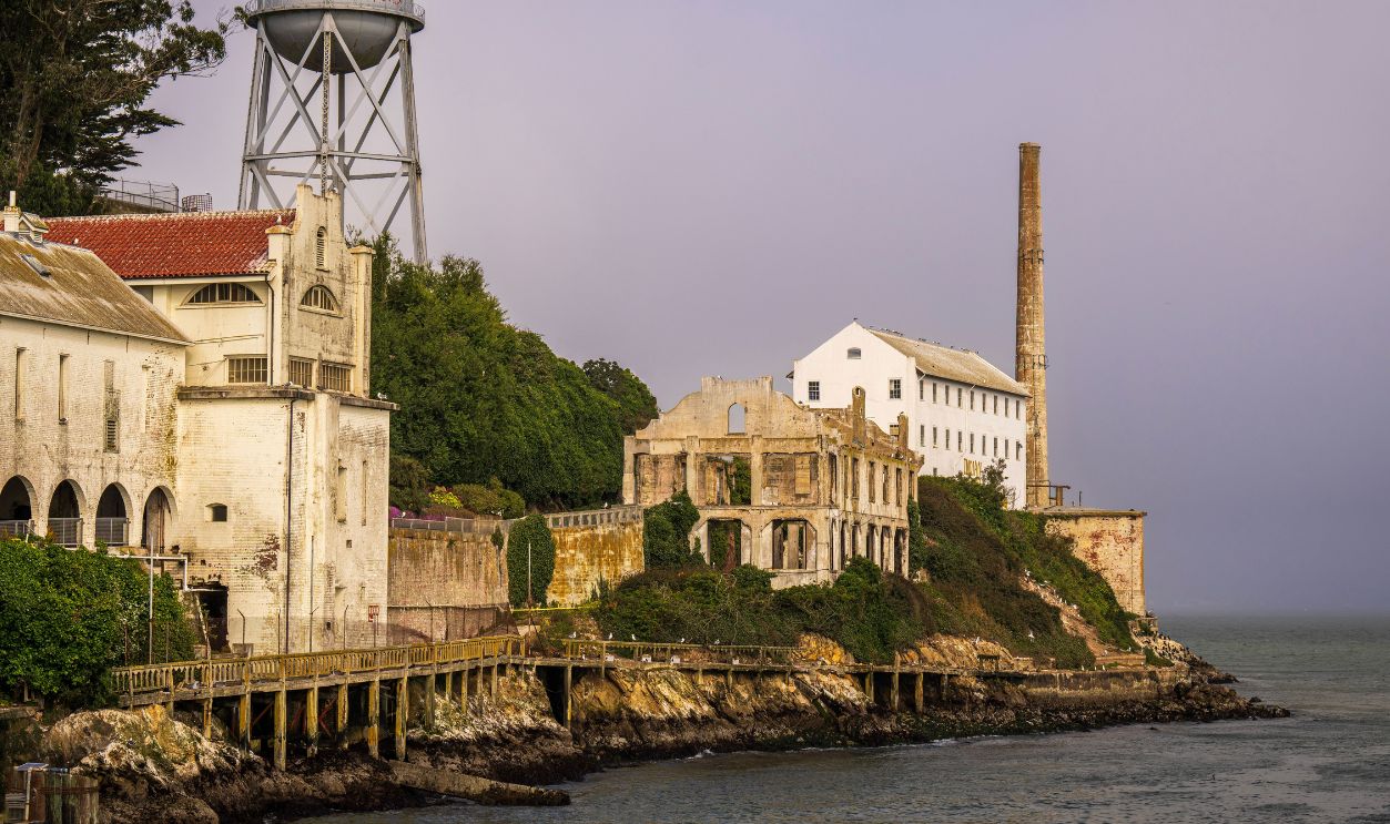 View of Alcatraz Island's historic ruins and water tower in San Francisco Bay
