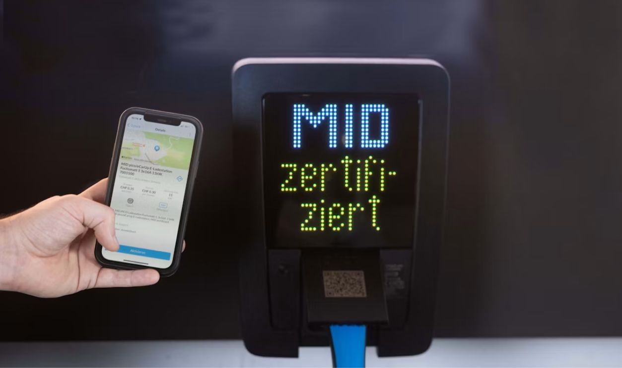 Smartphone held near mid certified charging station