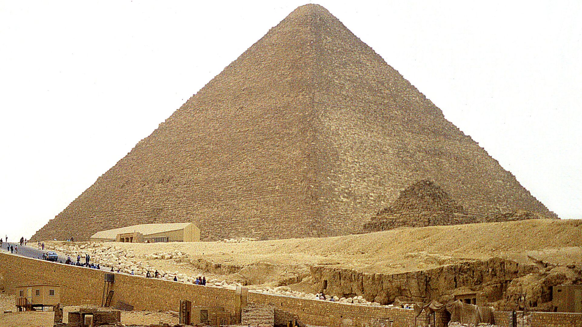 The Great Pyramid of Giza (also known as the Pyramid of Khufu or the Pyramid of Cheops) is the oldest and largest of the three pyramids in the Giza pyramid complex bordering what is now El Giza, Egypt. It is the oldest of the Seven Wonders of the Ancient