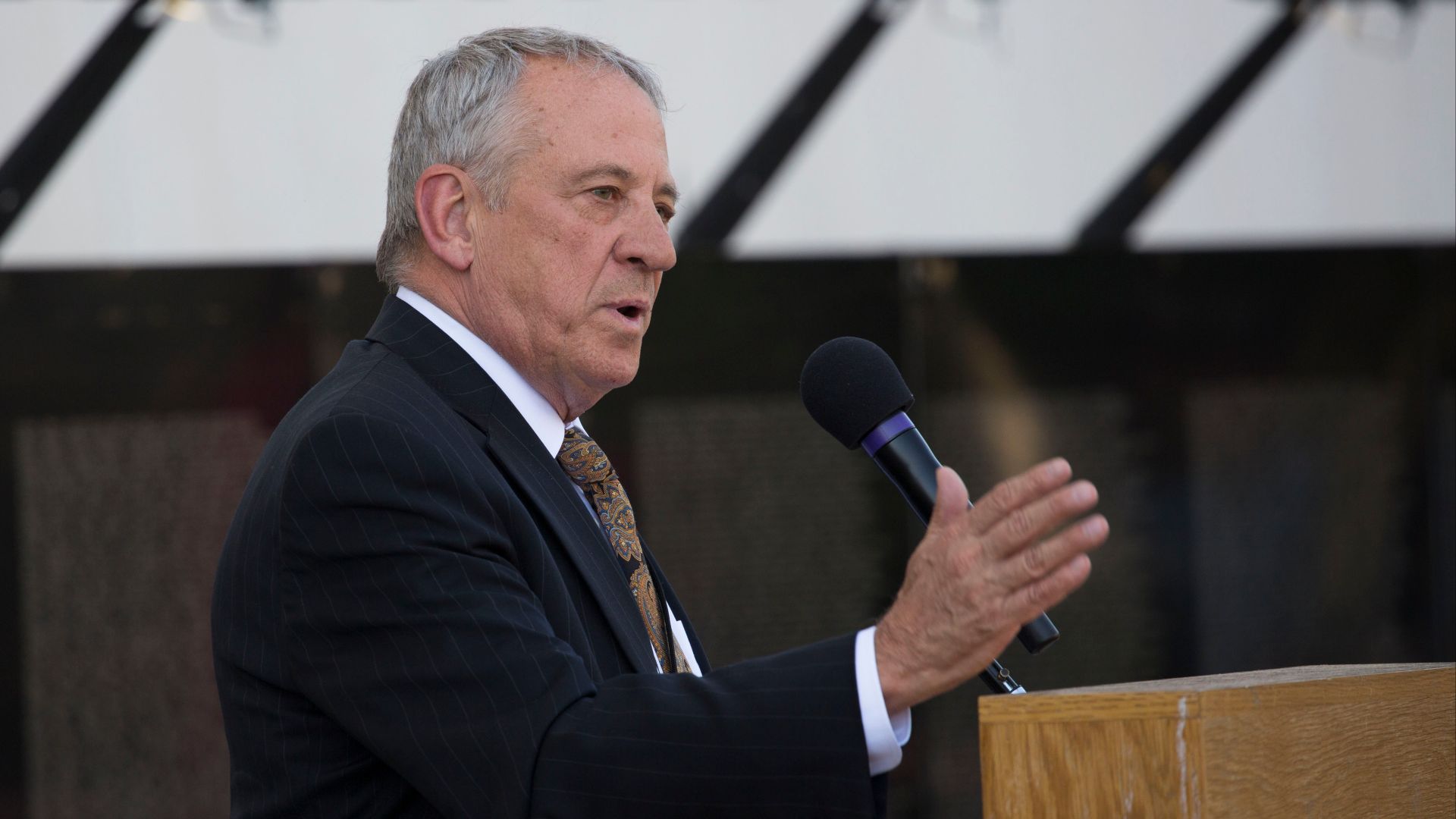 Jan Scruggs, founder and president emeritus of the Vietnam Veterans Memorial Fund and the driving force behind the creation of the Vietnam Veterans Memorial in Washington, D.C., recognizes the contributions of Vietnam War veterans in a ceremony outside th