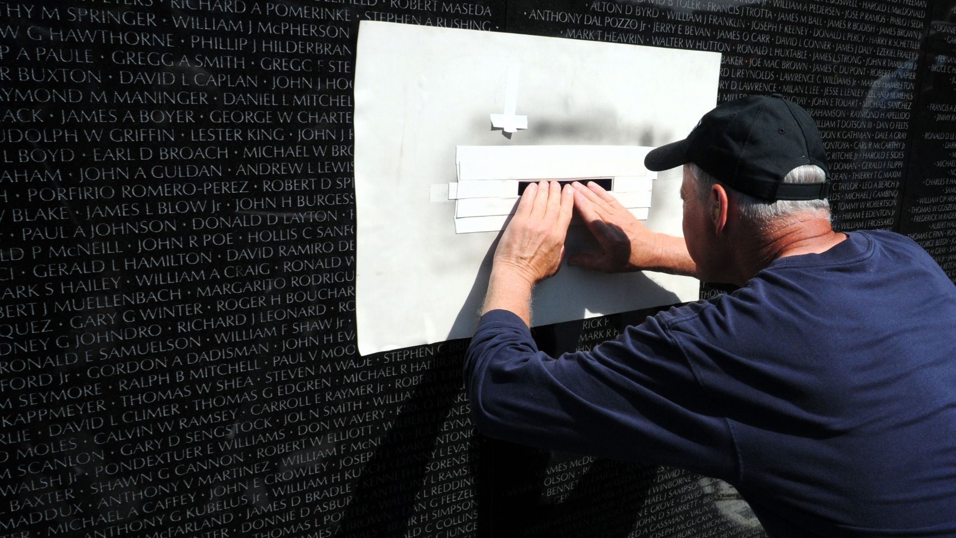 Expert stoneworker James Lee prepares to engrave during the Vietnam Veterans Memorial Fund Ceremony to add the name of U.S. Army Lt. Col. Taylor to Panel 7W, Line 81 of the Vietnam Veterans Memorial in Washington, D.C., May 4, 2010. Taylor's name is one o