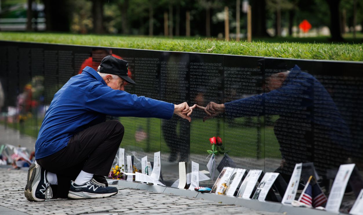 A man touches a name etched into the Vietnam Veterans Memorial on Memorial Day on May 26, 2025 in Washington, DC. Memorial Day is dedicated to those who gave their lives while serving in the U.S. Armed Forces.