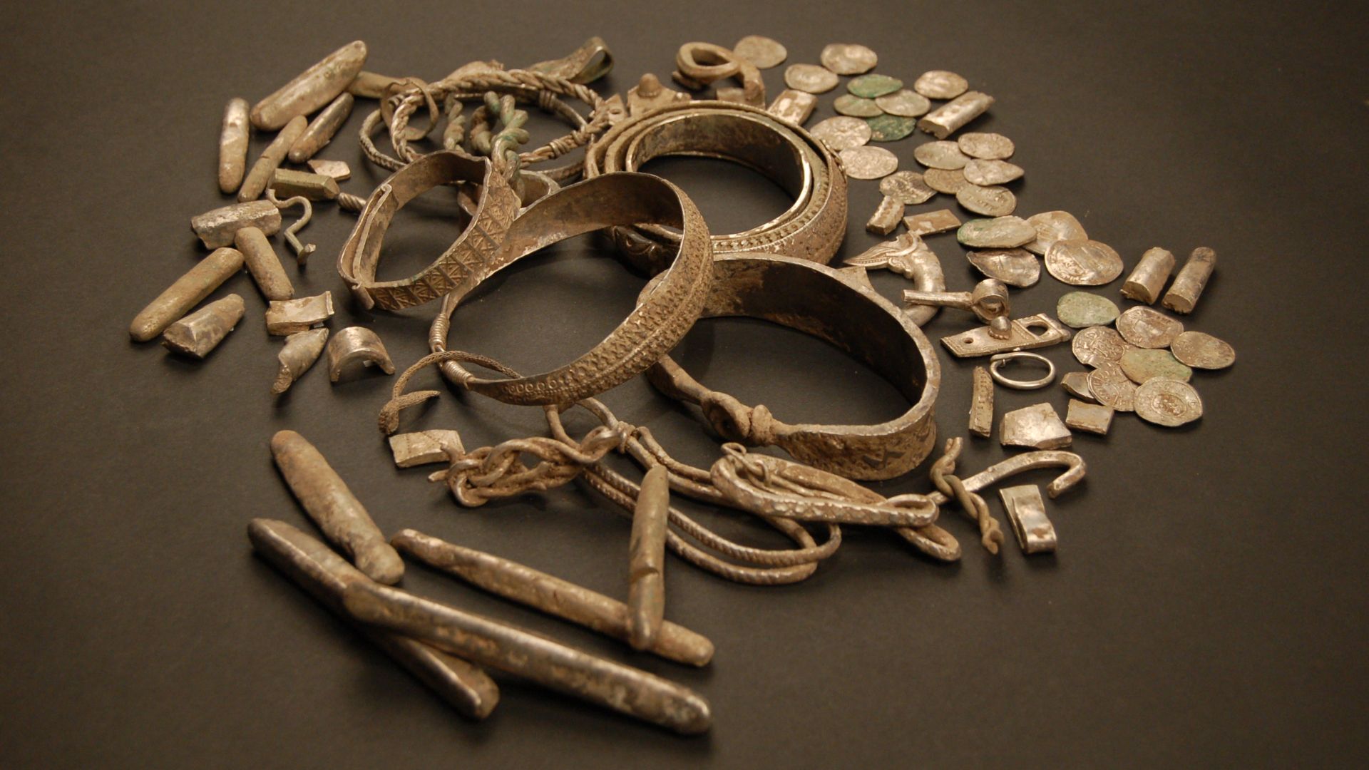 Silver coins, jewellery, ingots and hacksilver from a early 10th century Viking hoard discovered in Silverdale, Lancashire in September 2011.