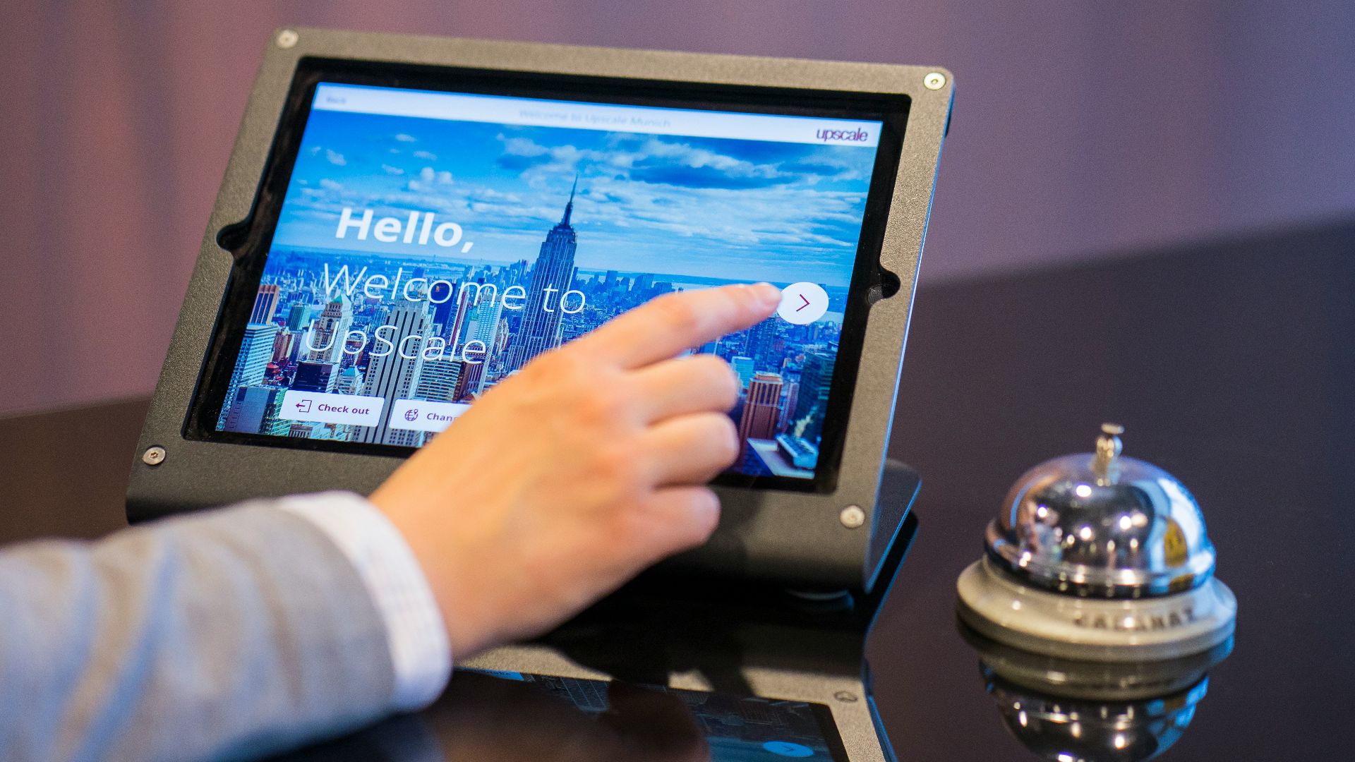 person about to touch black Android tablet computer