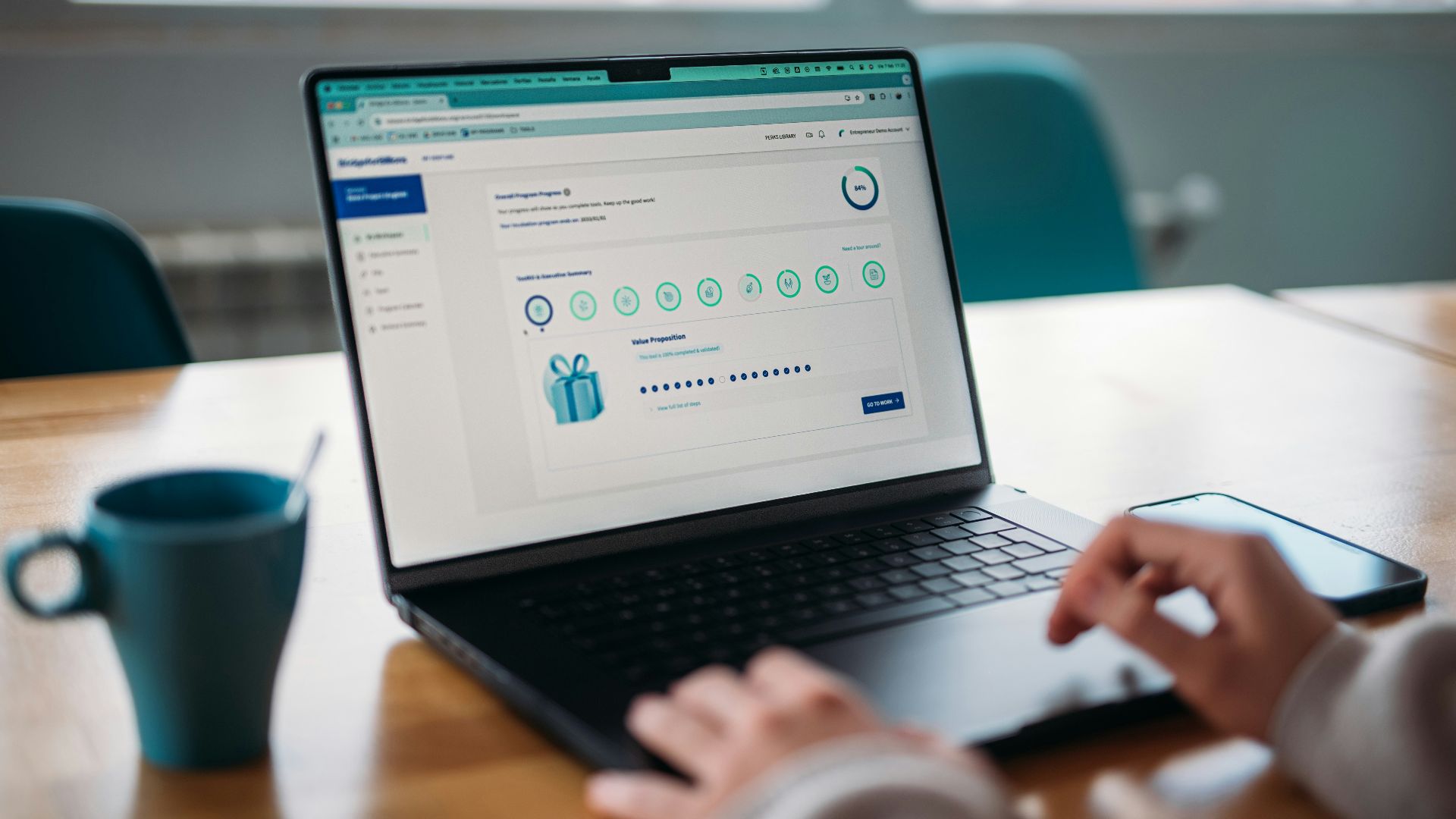 Person using a laptop to review a rewards program.